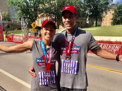 Linsey Davis and Paul Roberts are wearing a matching clothes, i.e., Grey Tees and a Red Cap.